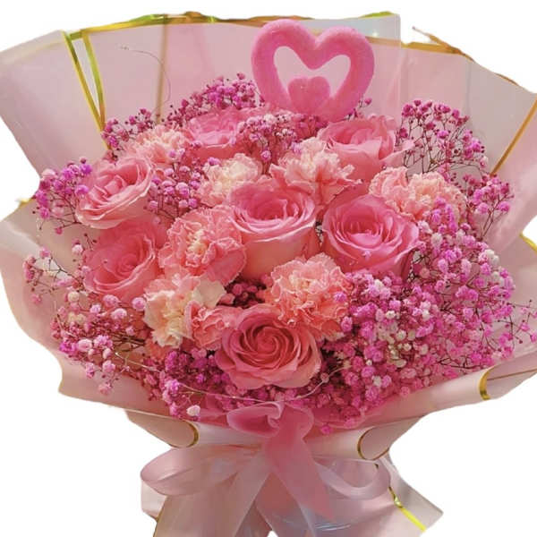 Pink rose bouquet with baby's breath wrapped in pale pink paper