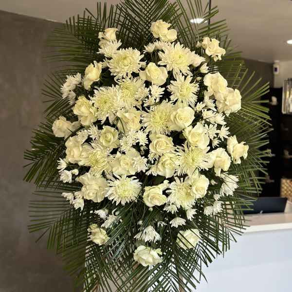 White floral standing spray with roses and chrysanthemums