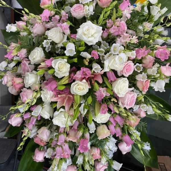 Large pink and white floral spray with roses and lilies