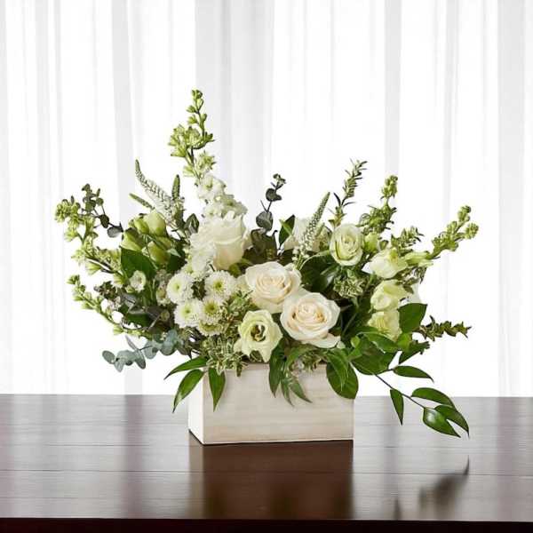 White floral arrangement in a rectangular white box