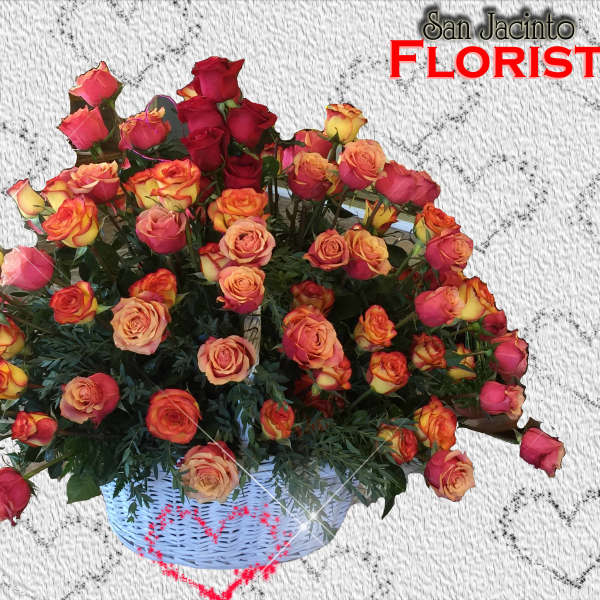 Basket of multicolored roses with pink and orange blooms