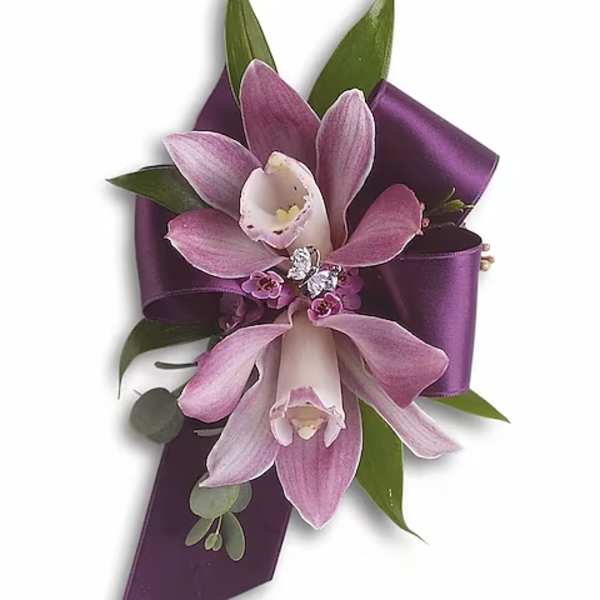 Purple orchid corsage with satin ribbon and green leaves