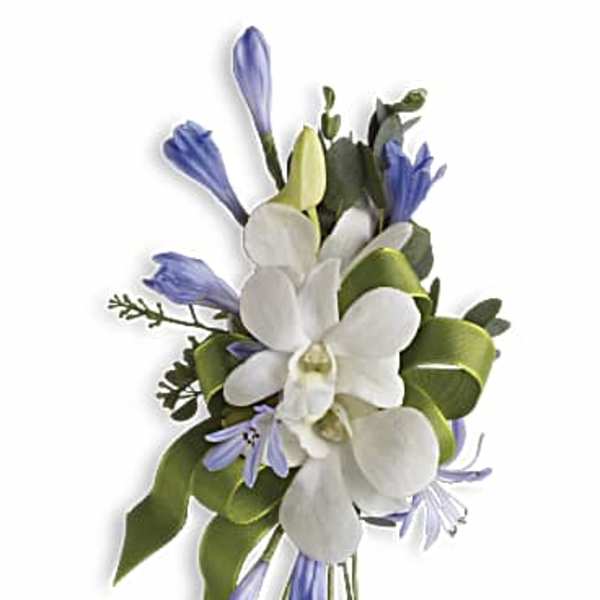 White orchid and light purple flower corsage with green ribbon accents