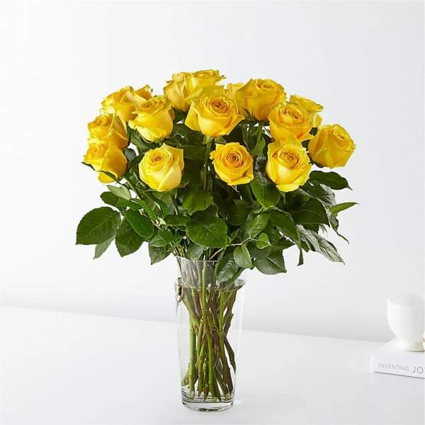 Bouquet of yellow roses in a clear glass vase