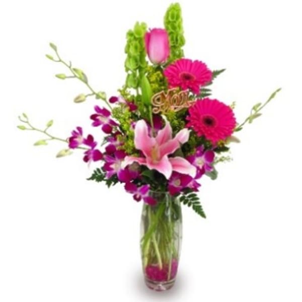 Pink and purple mixed bouquet in a clear glass vase