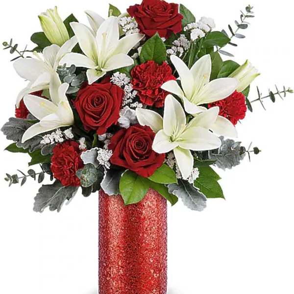 Red roses and white lilies in a red glitter vase