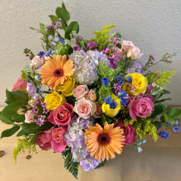 Colorful bouquet with roses, gerbera daisies, and hydrangeas