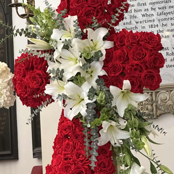 Red rose cross with white lilies and greenery