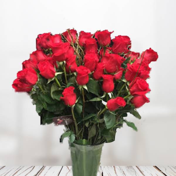 Bouquet of red roses in a green vase