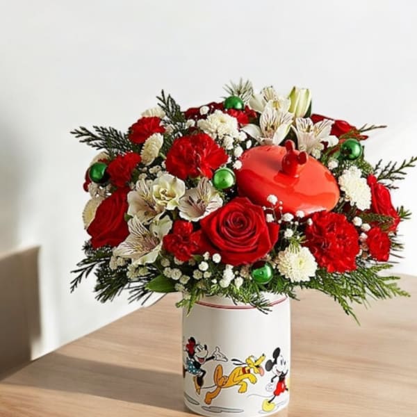 Red and white floral arrangement in a Mickey Mouse container