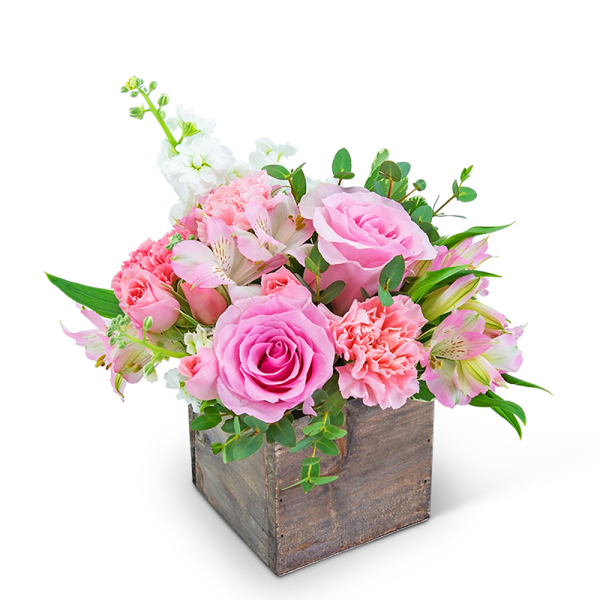 Pink and white floral arrangement in a rustic wooden box