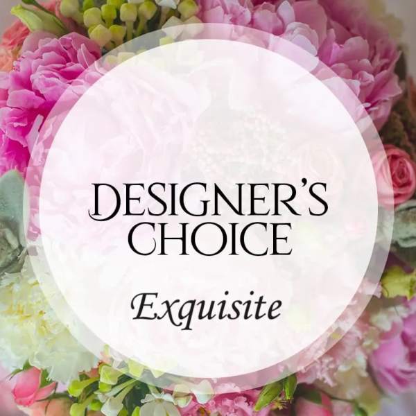 Pink and white floral arrangement with a designer's choice label