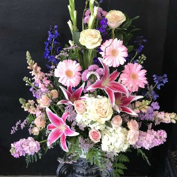 Tall mixed bouquet with pink lilies, roses, and gerbera daisies