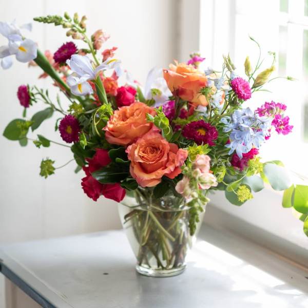 Colorful mixed bouquet in a clear glass vase
