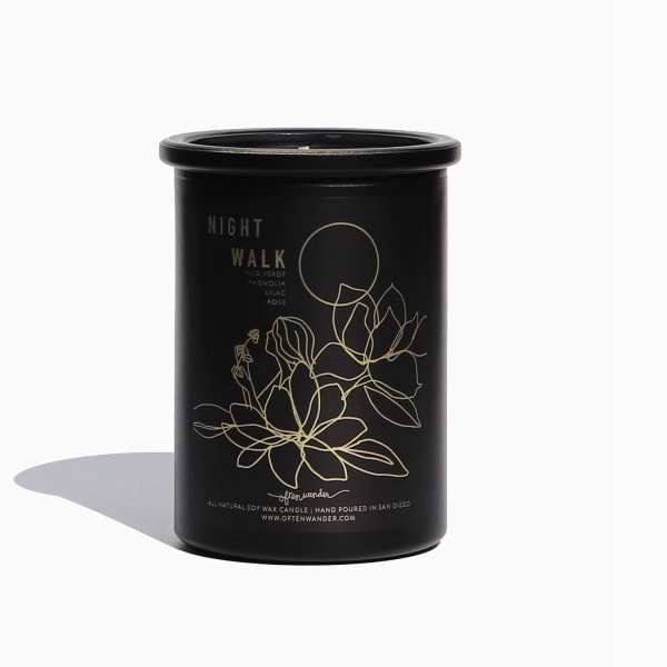 Black candle jar with gold floral line art and Night Walk label