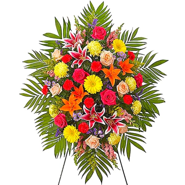 Colorful standing floral spray with lilies, roses, and daisies