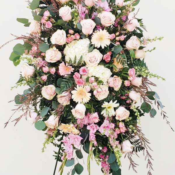 Standing floral spray with pale pink roses and gerbera daisies