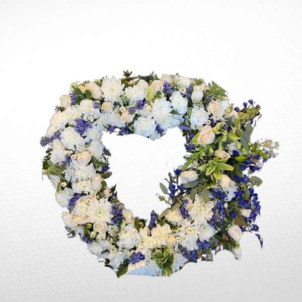 Heart-shaped floral wreath with white and blue flowers