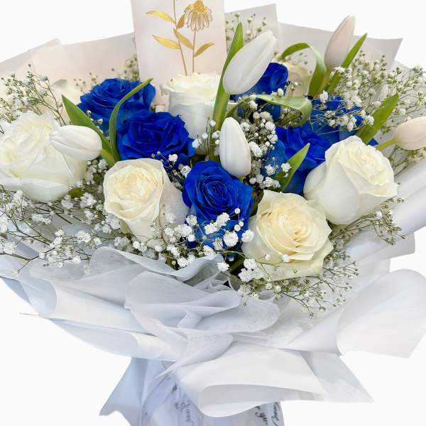 Bouquet of blue and white roses with white tulips