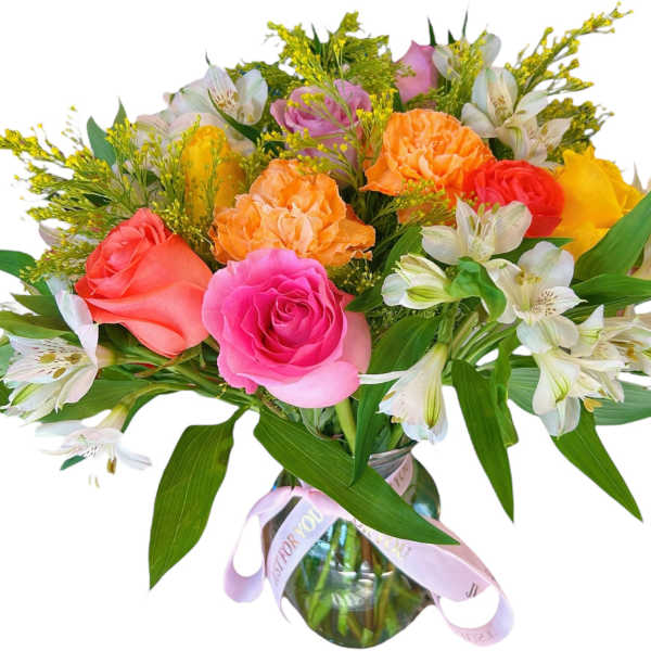 Mixed bouquet of roses and alstroemeria in a glass vase