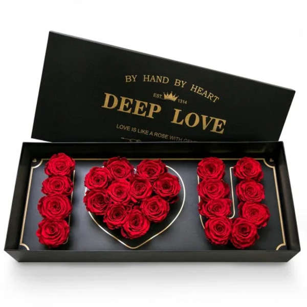 Red roses arranged in a black gift box spelling "I LOVE U"