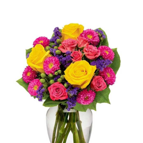 Mixed bouquet of yellow and pink roses in a clear glass vase
