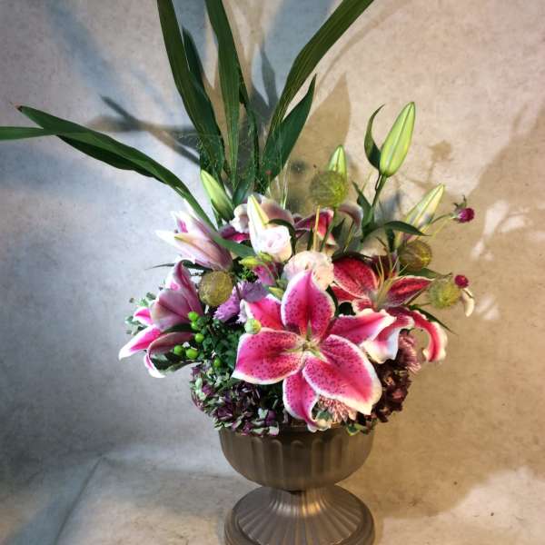 Stargazer Urn, A showy elegant, dispay of Stargazer Lulies, Tropical Foliages, roses Hydrangea.