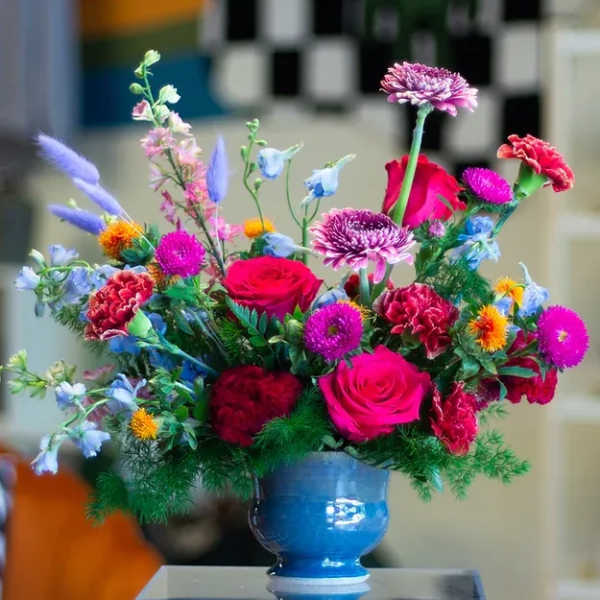 Colorful mixed bouquet in a blue vase