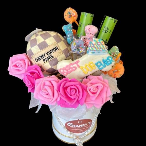 Pink rose bouquet with a dog-themed gift arrangement in a white box