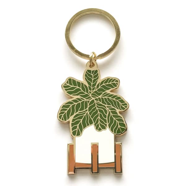 Keychain with a green leaf-shaped charm and metal ring