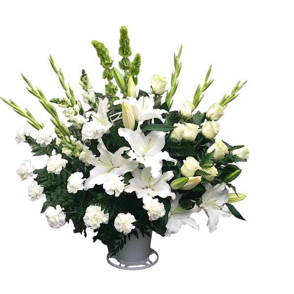 White lilies and carnations in a gray vase