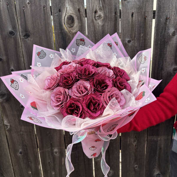 Pink rose bouquet wrapped in Hello Kitty paper with ribbon