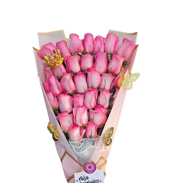 Bouquet of pink roses wrapped in pink paper with a ribbon