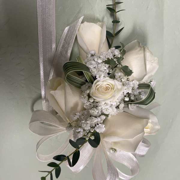 White rose bouquet with ribbon and greenery accents