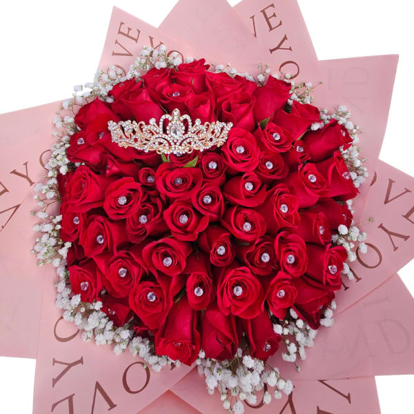 Bouquet of red roses with baby’s breath and a jeweled tiara topper