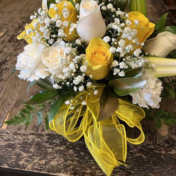 Yellow and white rose bouquet with baby's breath and lilies