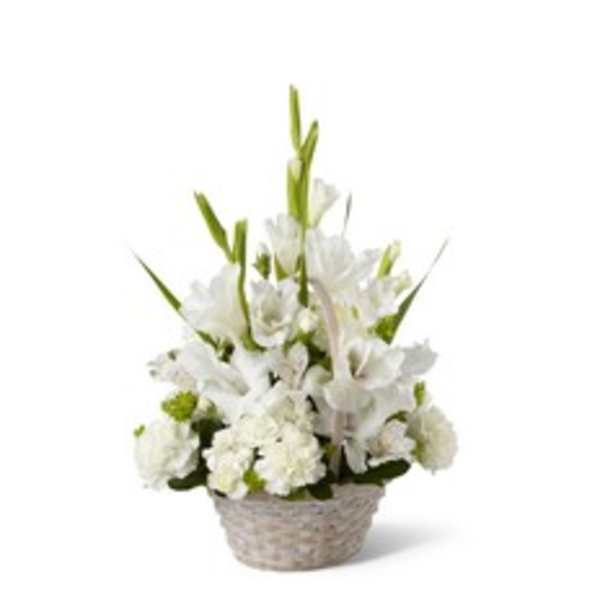 White floral arrangement in a woven basket