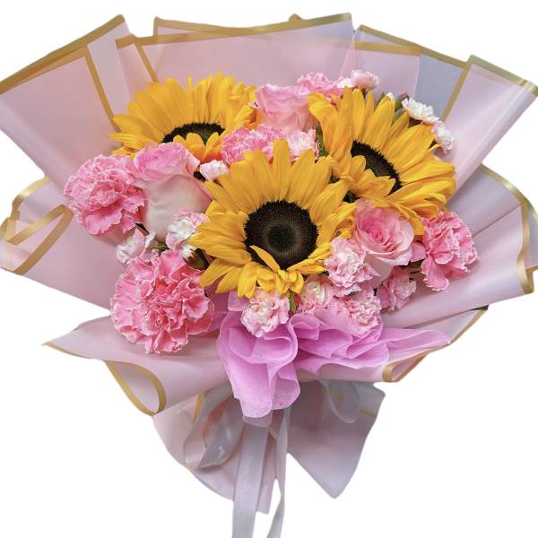 Bouquet of sunflowers and pink carnations wrapped in pink paper