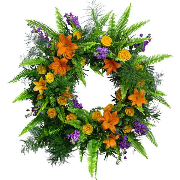 Green fern wreath with orange lilies, yellow roses, and purple flowers