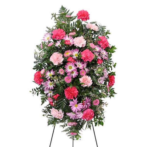 Standing spray of pink and lavender flowers on an easel