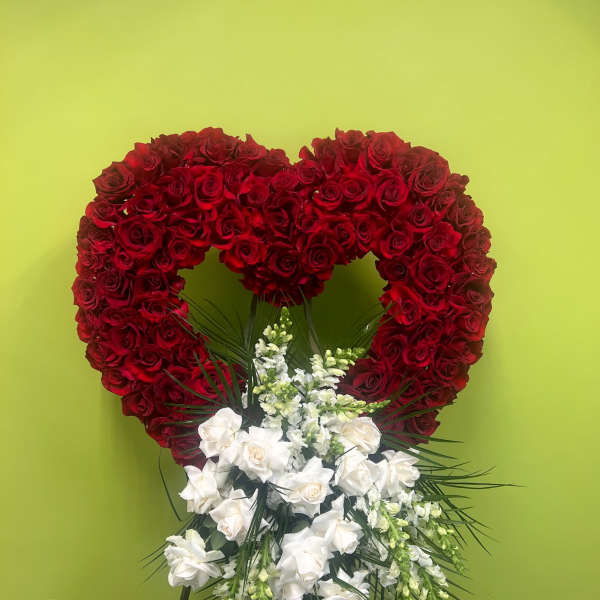 Heart-shaped red rose standing spray with white flowers below