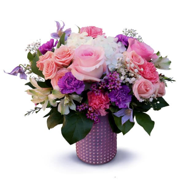 Pink and purple mixed bouquet in a textured lavender vase