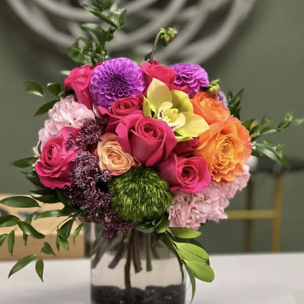 Colorful mixed bouquet in a clear glass vase