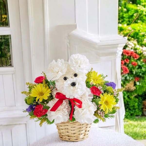 Flower basket arranged as a white teddy bear with a red bow