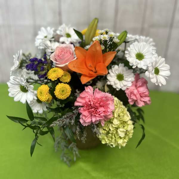 Mixed bouquet with orange lily, pink rose, white daisies, and carnations