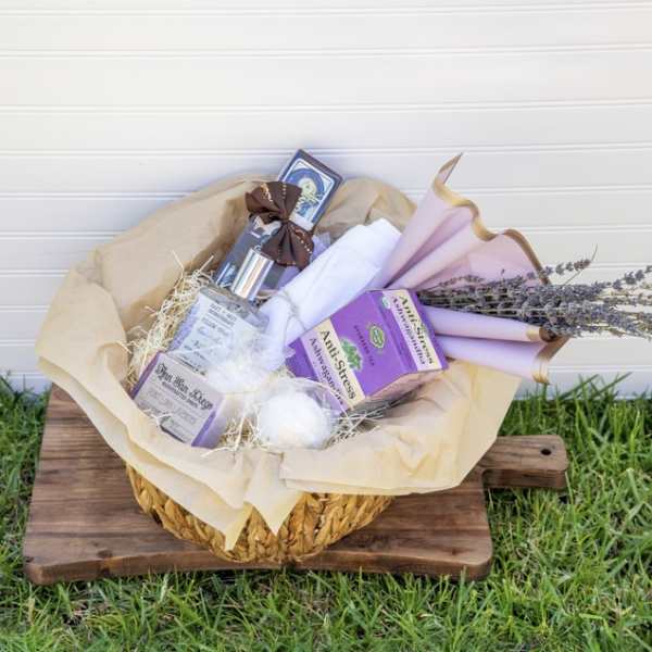 Gift basket with lavender-wrapped items and dried flowers