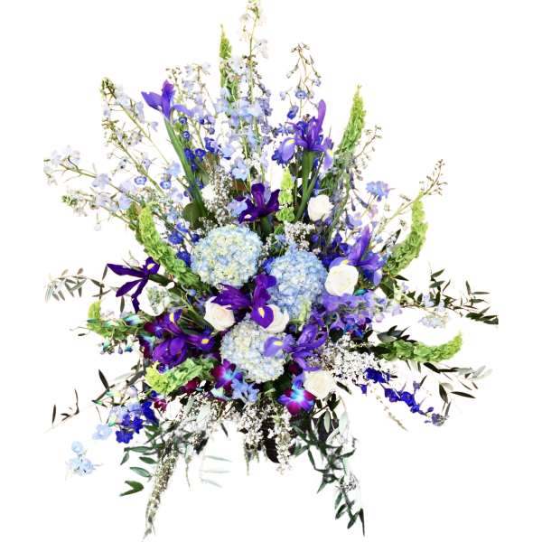 Tall bouquet of blue and purple flowers with white roses