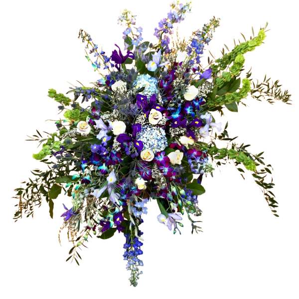 Large spray of blue, purple, and white flowers with trailing greenery