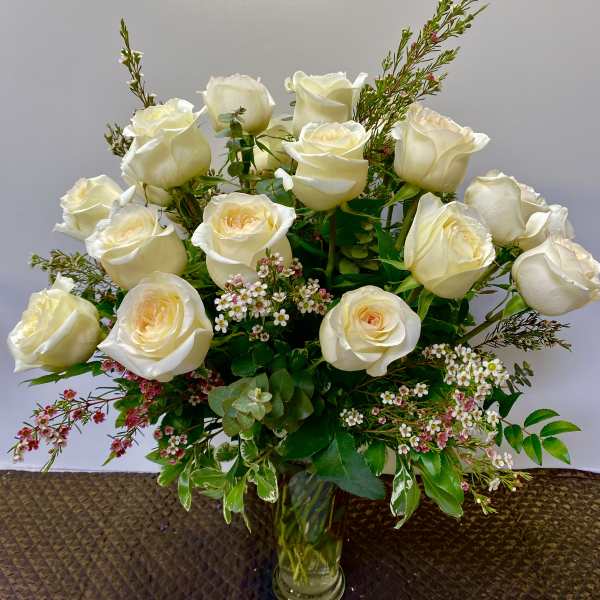 Bouquet of white roses in a clear glass vase