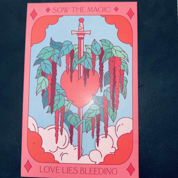 Illustrated card with a sword through a heart and hanging vines